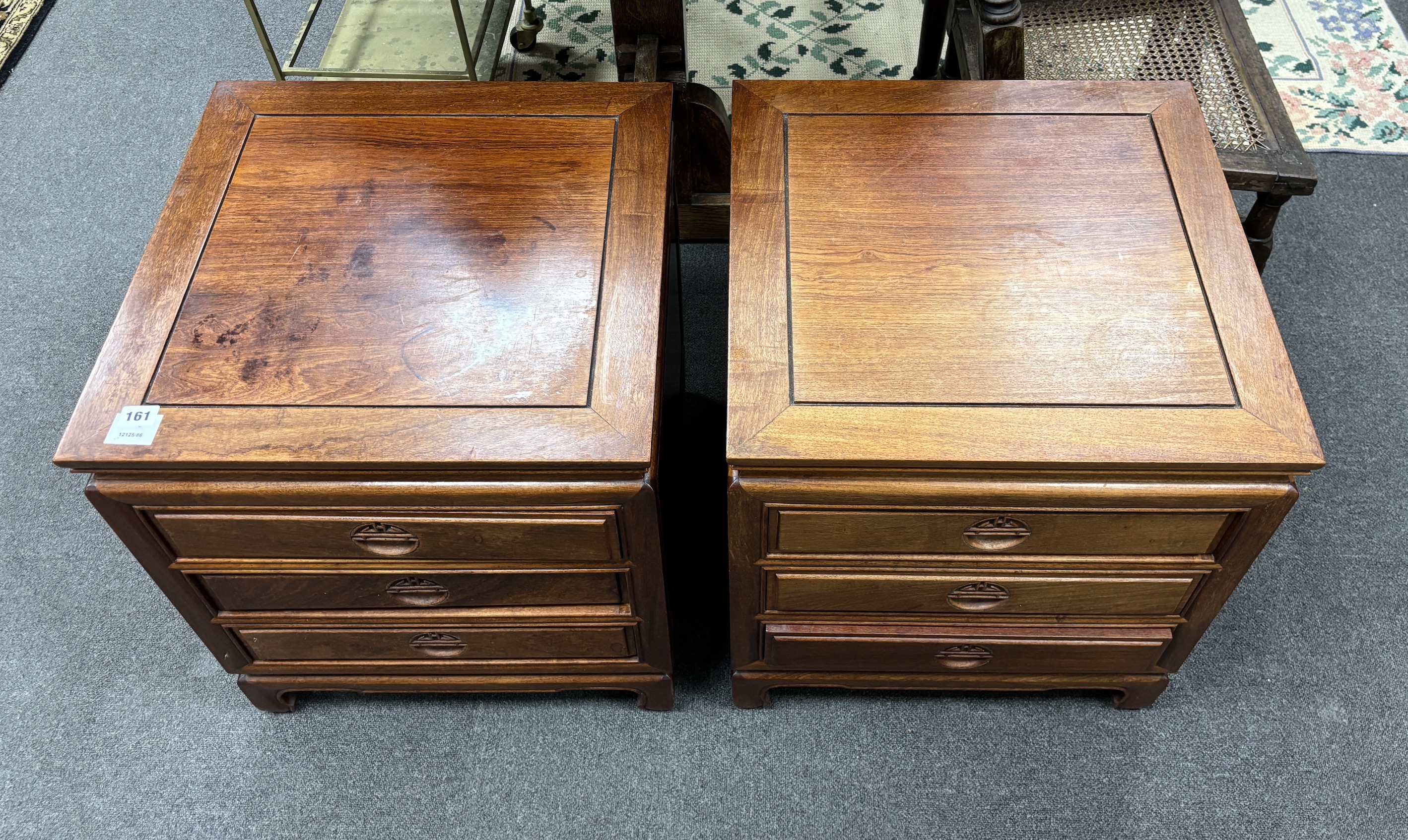 A pair of Chinese hardwood three drawer bedside chests, width 50cm, depth 50cm, height 56cm